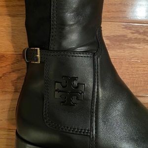 Black Tory Burch over the knee leather boots.